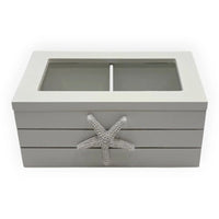 Gray coastal-style storage box with starfish accent and glass top, perfect for home décor