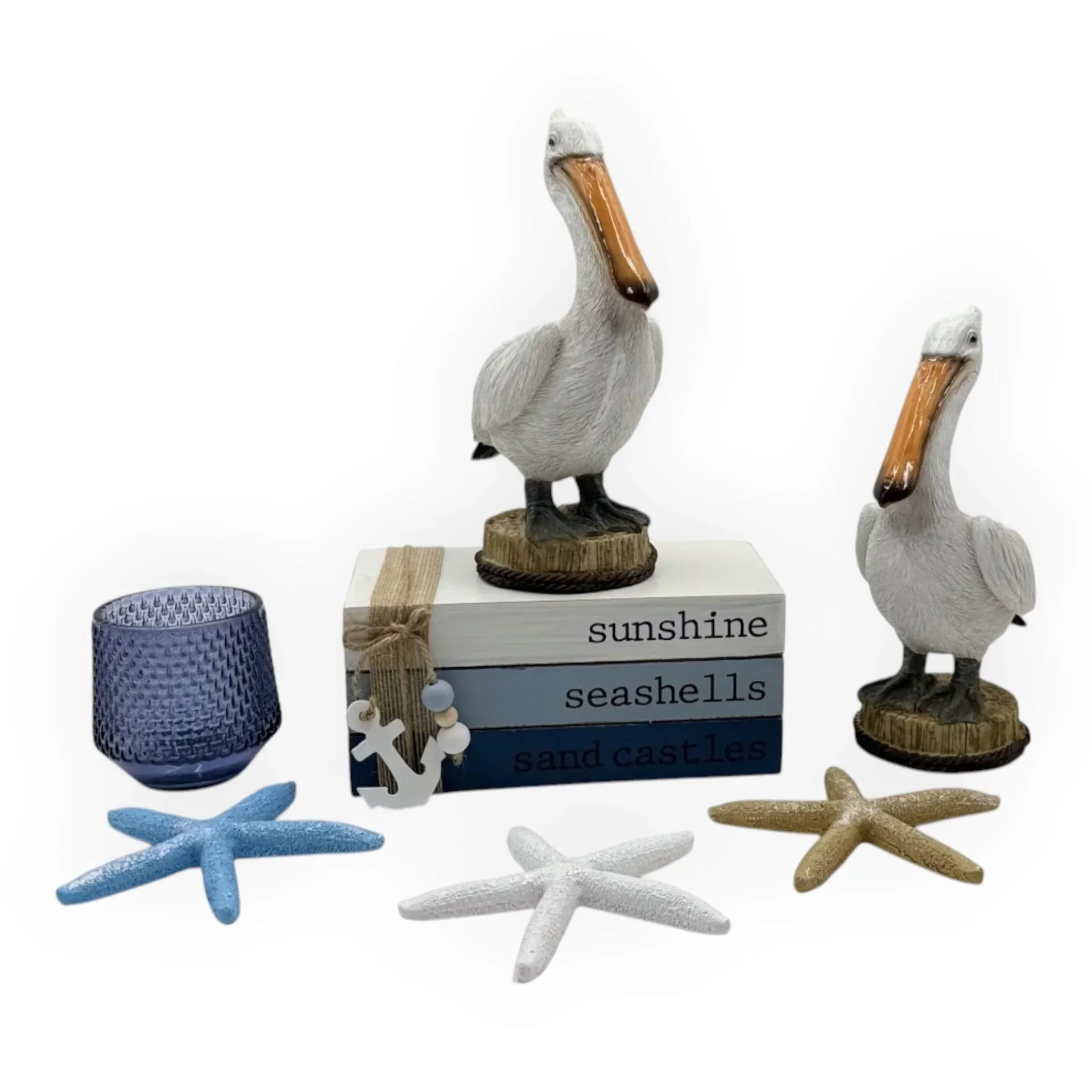 Coastal home décor set with pelican figurines, starfish, and 'sunshine seashells' box for nautical styling