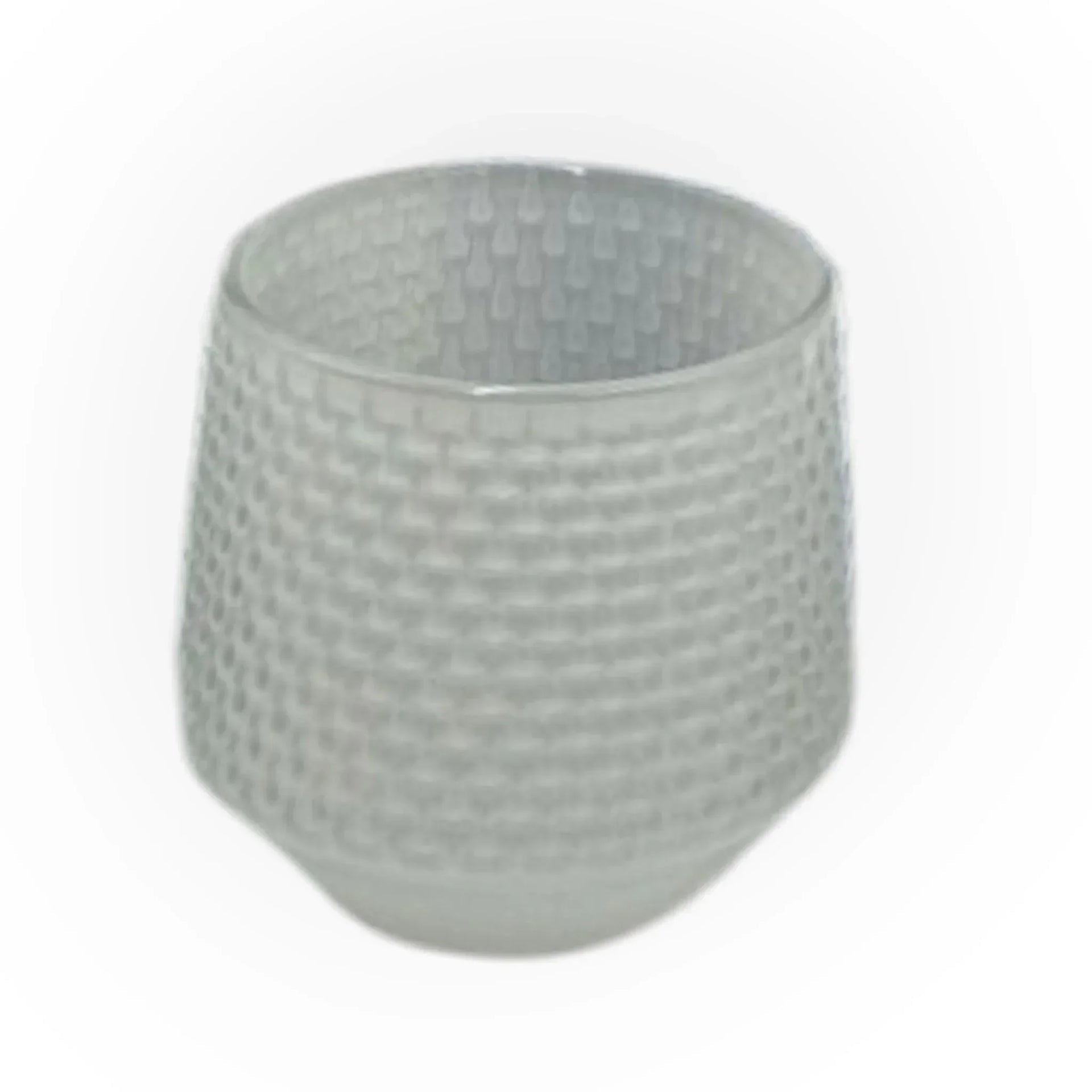 Textured grey glass tumbler with woven pattern, modern home décor accessory