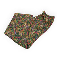 Vibrant floral print fabric with native Australian blooms, perfect for home décor and vintage-inspired interiors.