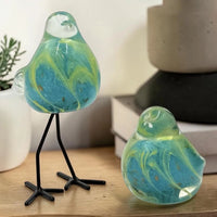 Handblown glass bird figurines with blue and green swirls, perfect for home décor and shelf styling