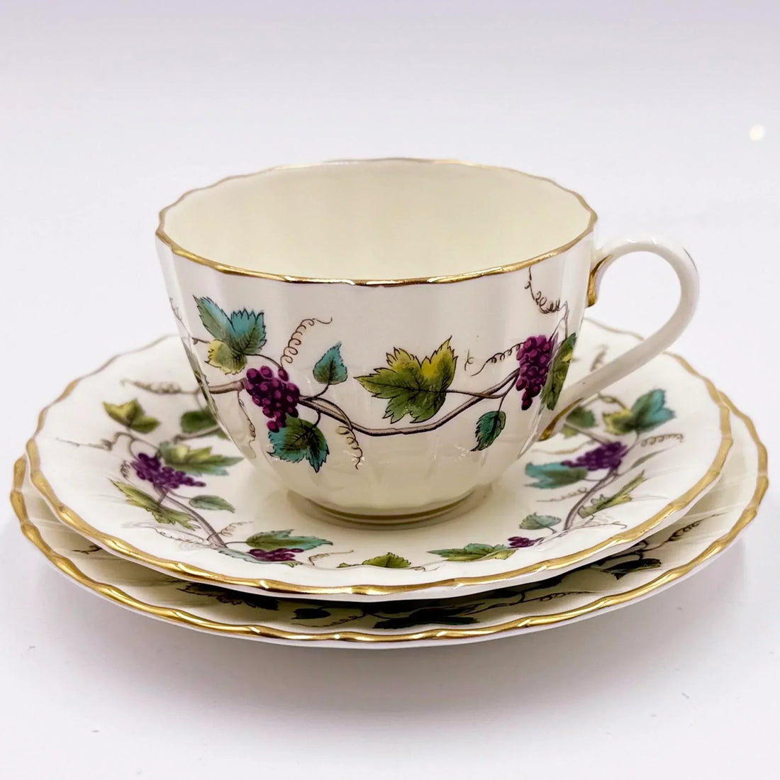 Vintage porcelain teacup and saucer set with grapevine pattern, gold trim, elegant home decor