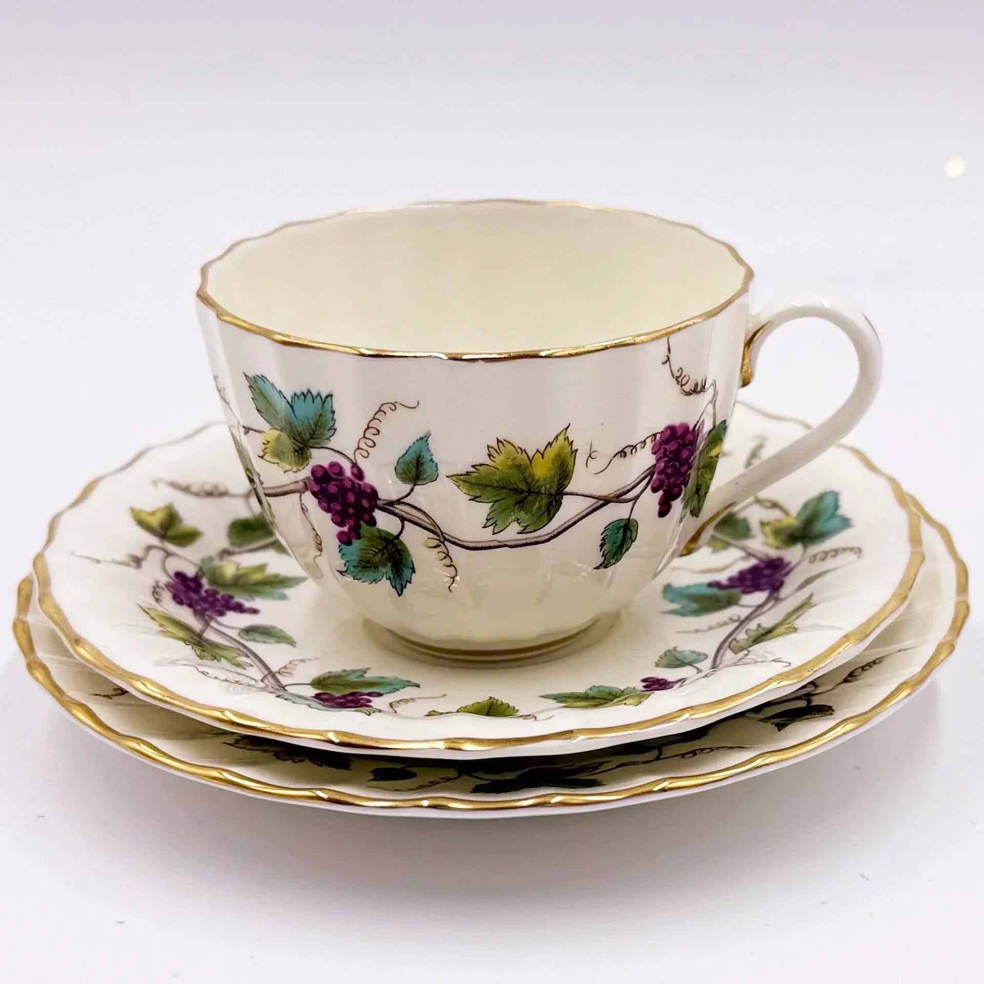 Vintage porcelain teacup and saucer set with grapevine pattern, gold trim, elegant home decor
