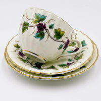 Vintage porcelain teacup and saucer set with grapevine pattern, gold trim, elegant home decor