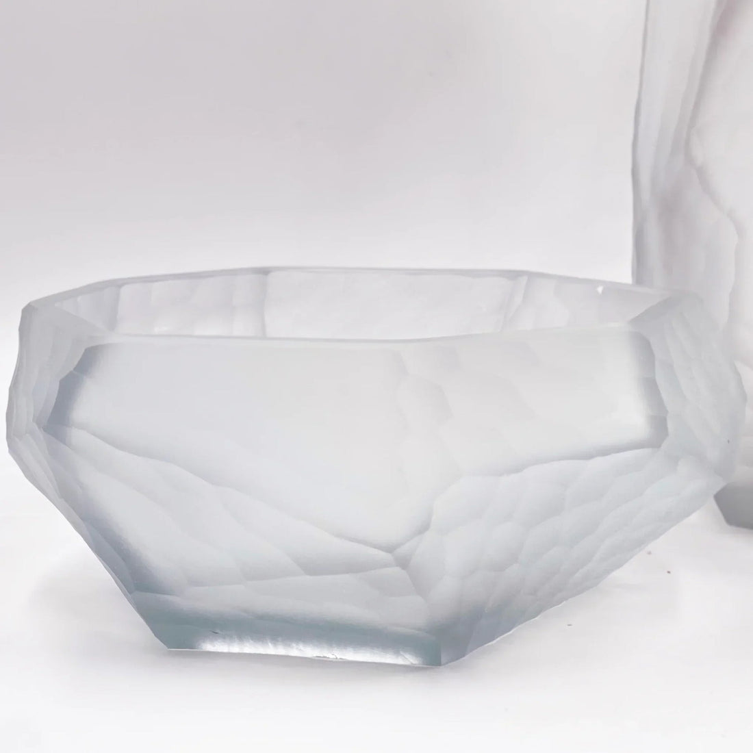 Frosted glass bowl with geometric facets, modern home décor accent piece
