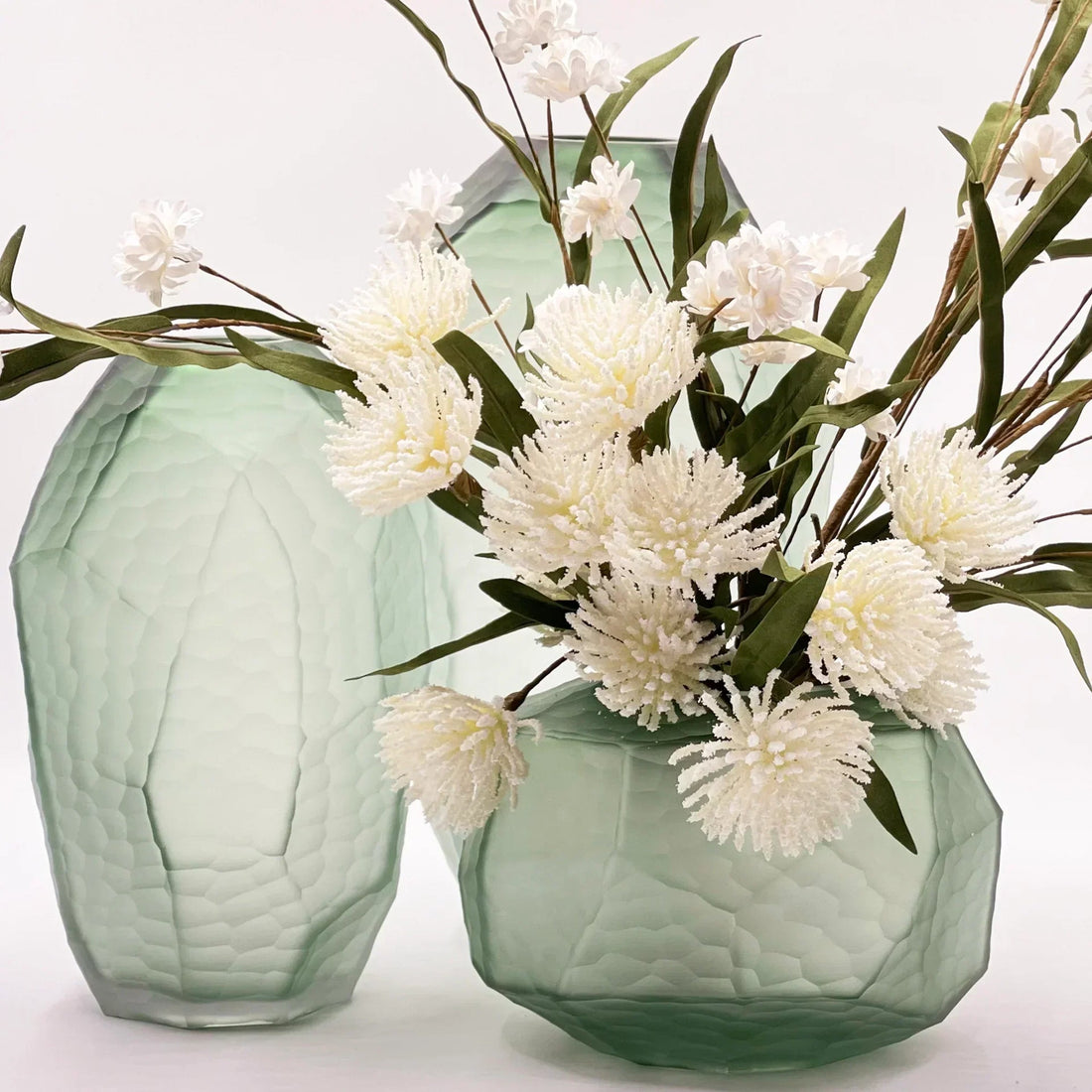Mint green textured glass vases with white artificial flowers, elegant home décor accent pieces