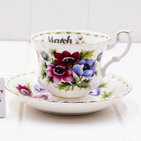Royal Albert Flower of the Month March Anemones teacup and saucer, showing bold crimson, pink and blue-purple anemones with gold trim