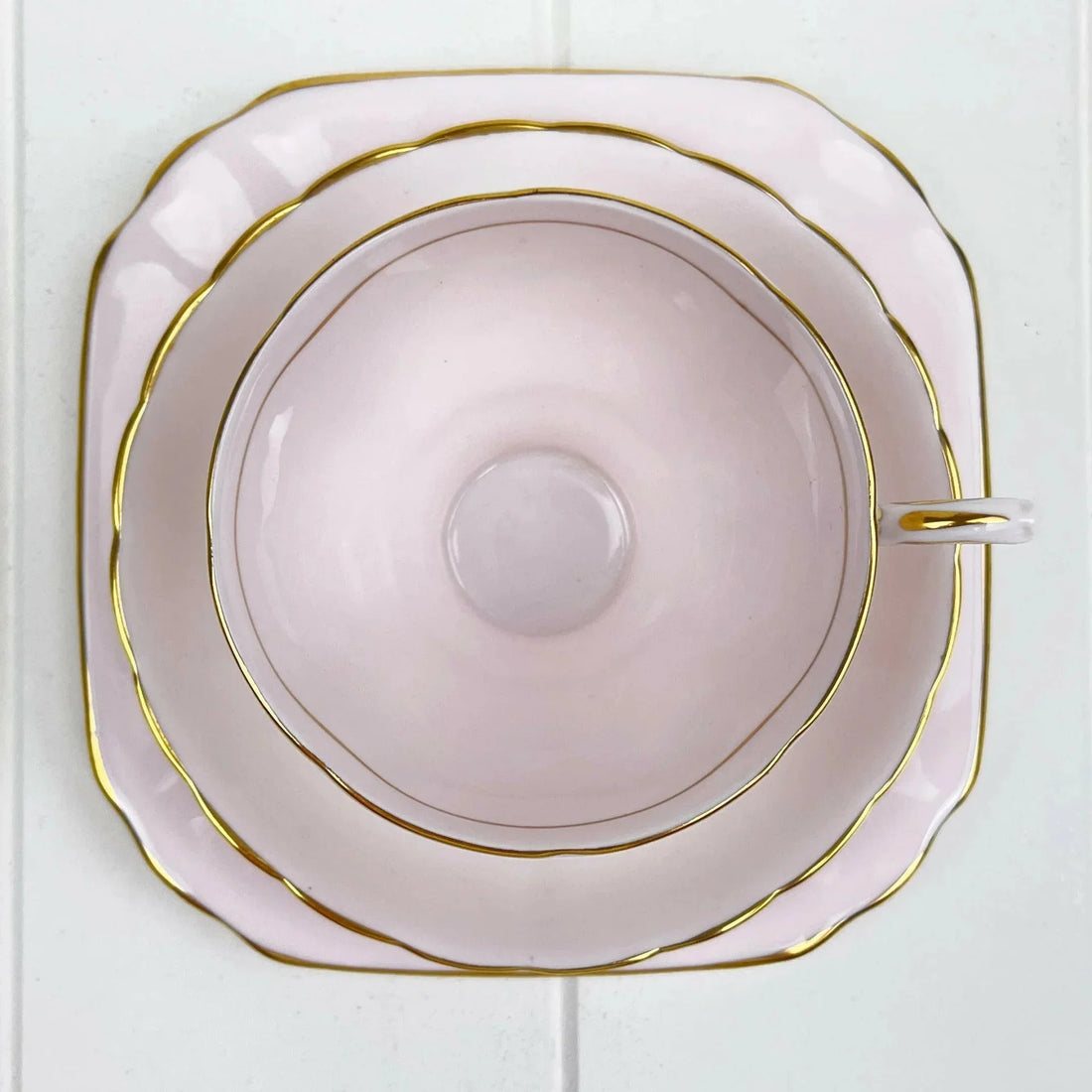 Pink porcelain teacup and saucer with gold trim, elegant home decor for tea time
