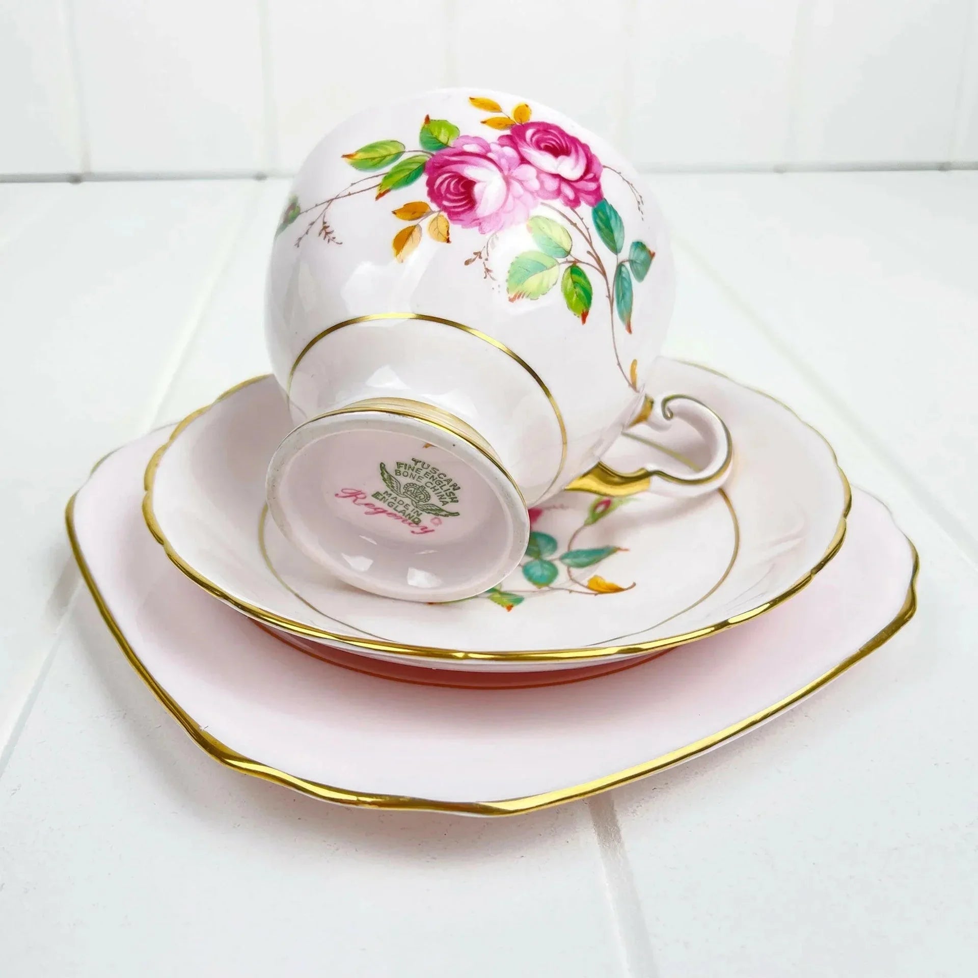 Elegant vintage tea cup and saucer set with pink rose floral design, gold trim, fine bone china