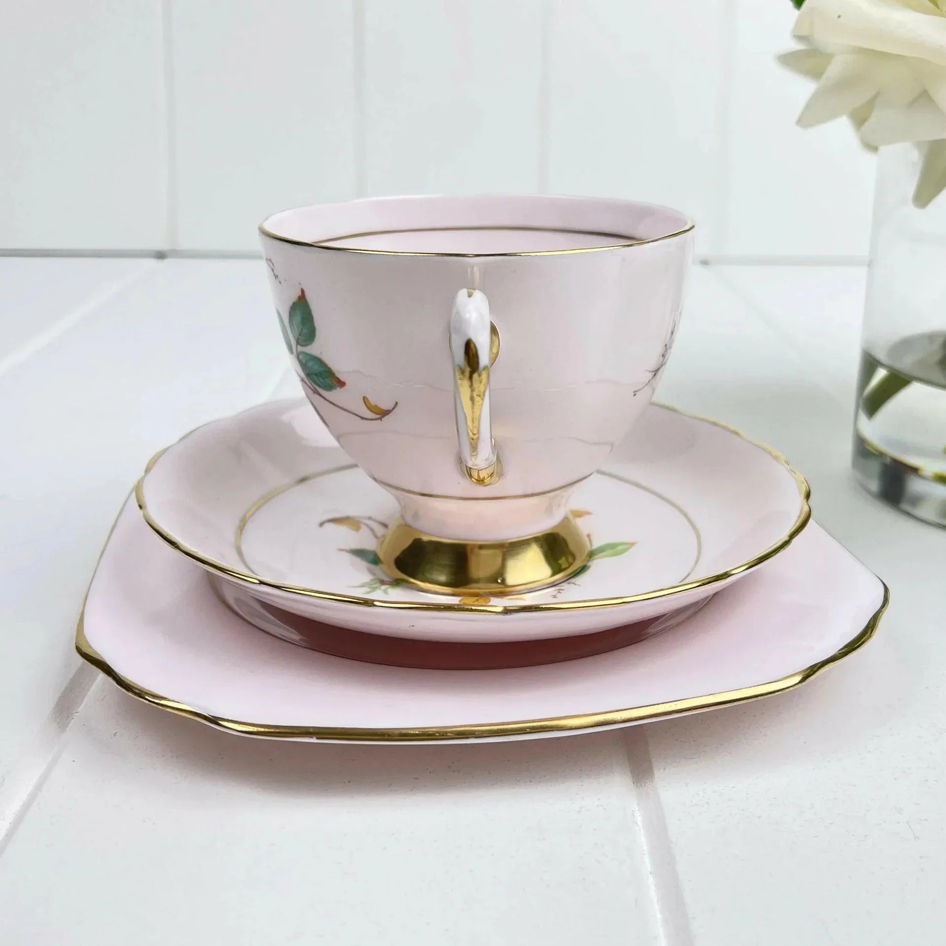 Elegant pink teacup with gold trim and floral design, perfect for home decor in Queensland