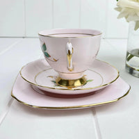 Elegant pink teacup with gold trim and floral design, perfect for home decor in Queensland