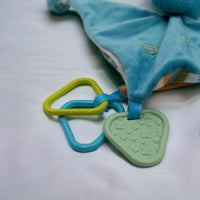 Blue baby comforter with green star teether and colorful rings, soft plush design for infants