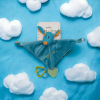 Blue knitted donkey comforter with soft blanket, teether, and rings on cloud-themed background