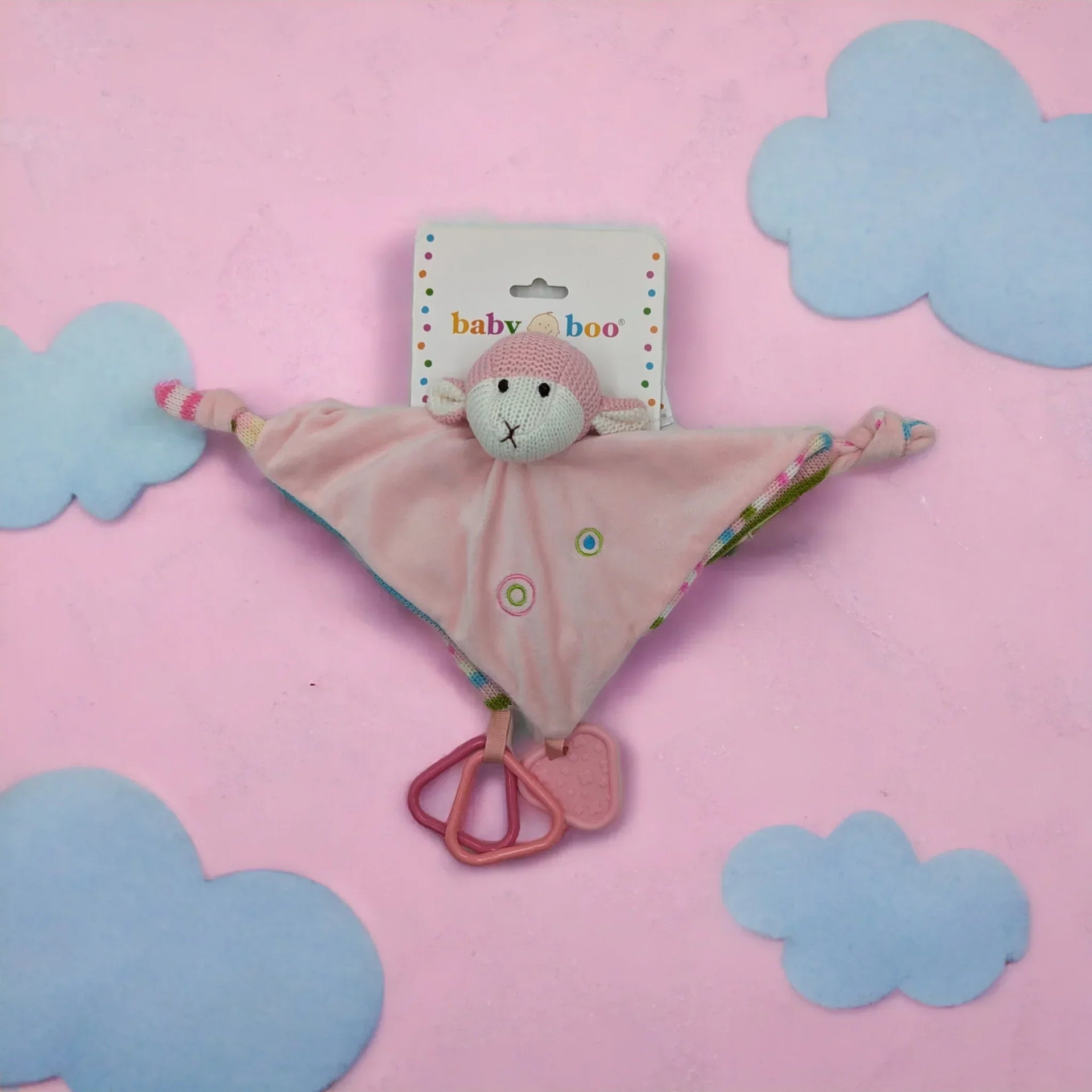 Pink baby comforter with knitted monkey head, teether rings, and soft fabric, perfect for newborns and infants.
