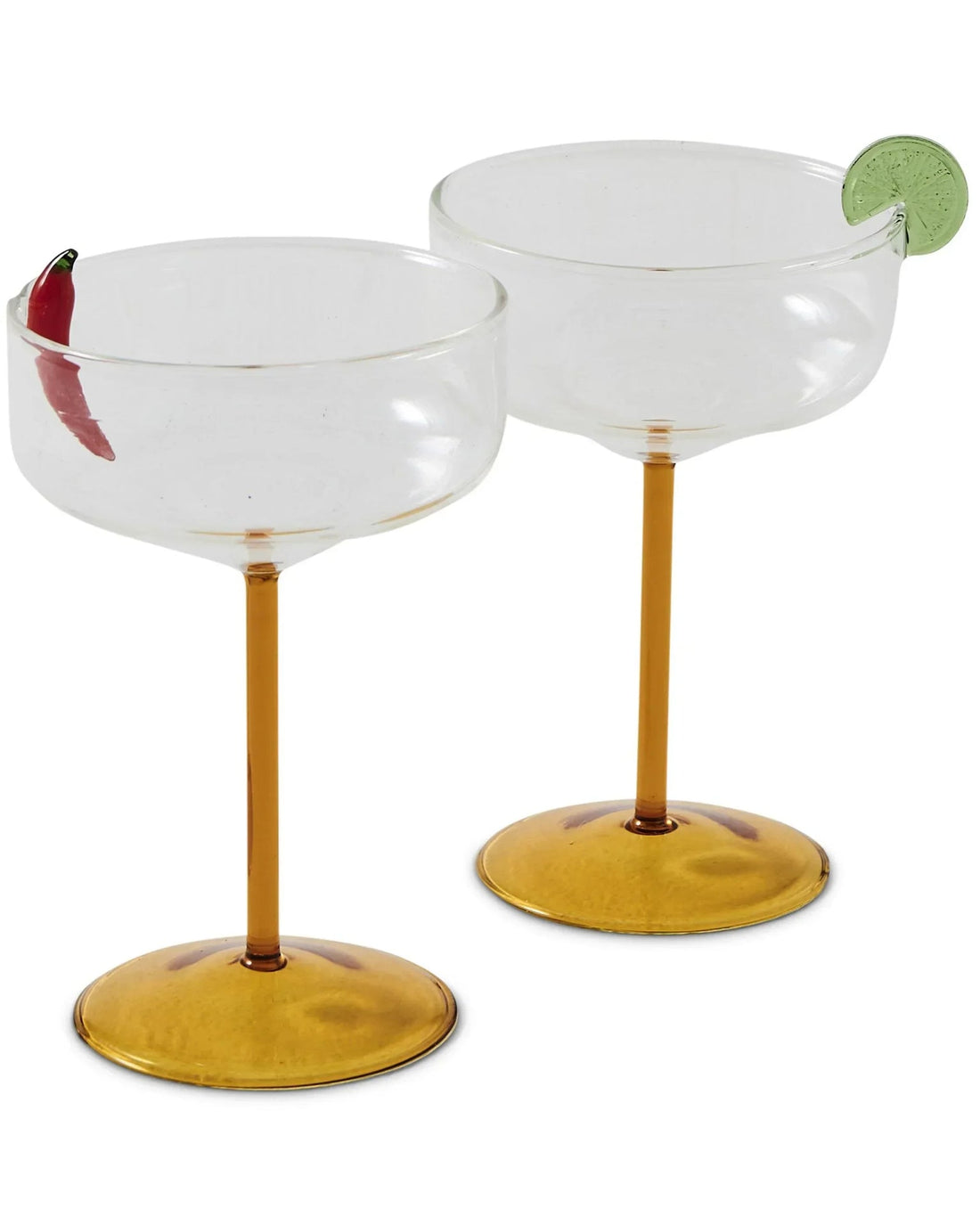 Elegant coupe glasses with gold stems, one garnished with chili, another with lime slice, perfect for cocktails and home décor.