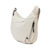 Beige hobo shoulder bag with side zipper pocket and adjustable strap, stylish everyday accessory