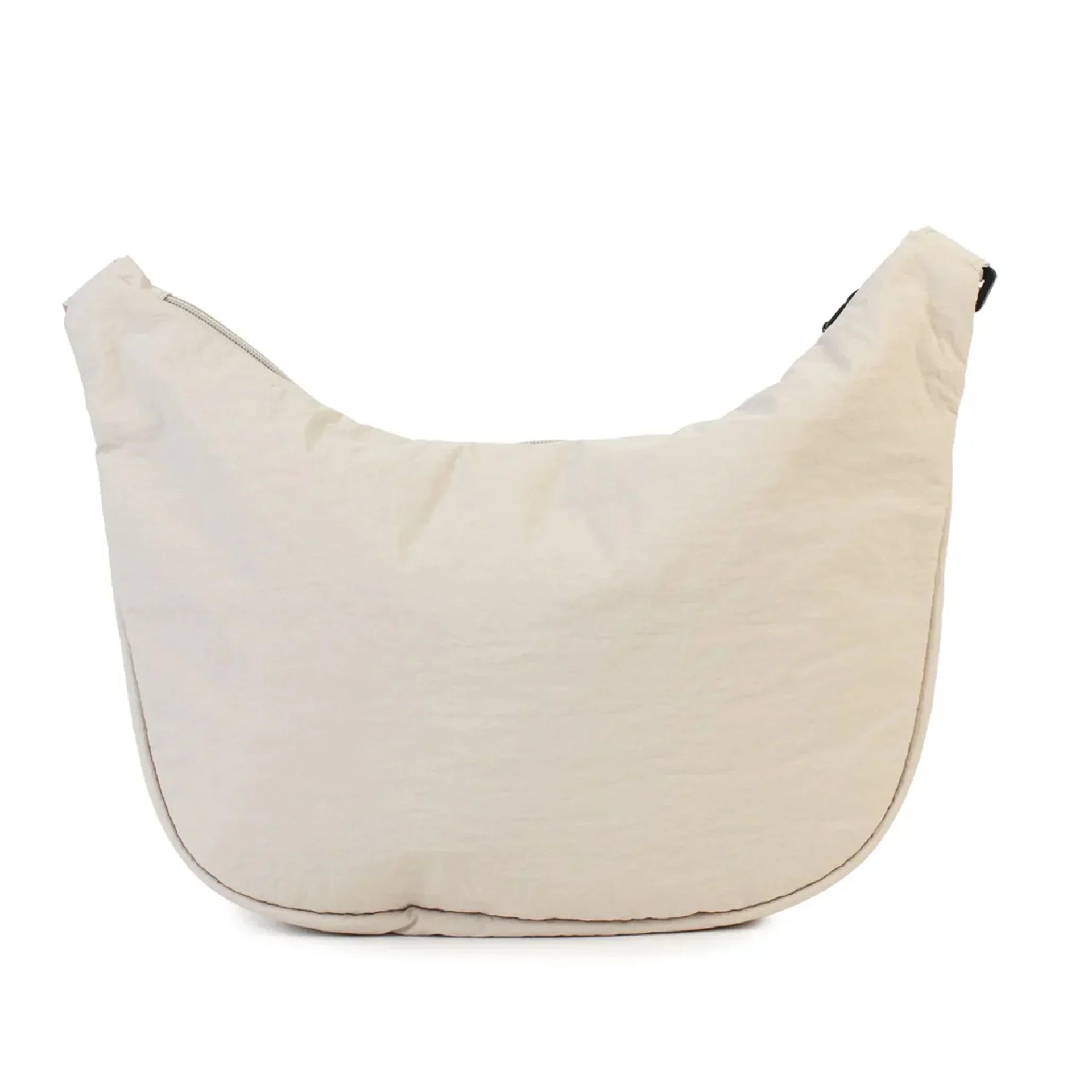 Cream canvas shoulder bag with minimalist design, perfect for everyday use and stylish home accessorizing.