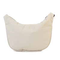 Cream canvas shoulder bag with minimalist design, perfect for everyday use and stylish home accessorizing.