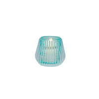 Turquoise ribbed glass candle holder with lit candle, elegant home décor accent