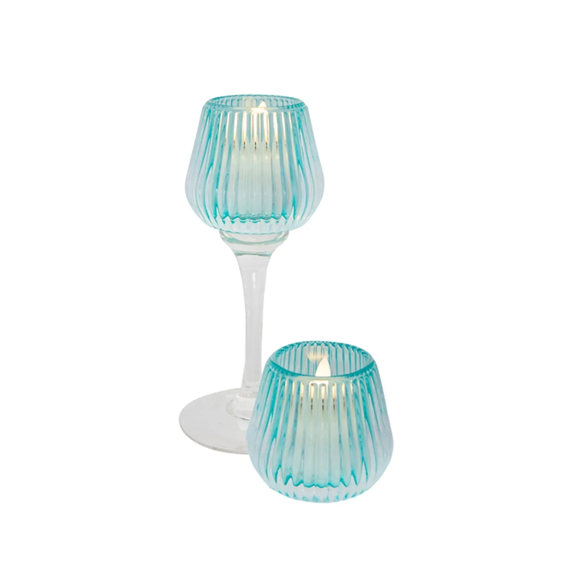 Turquoise ribbed glass candle holders with lit tea lights, elegant home décor accents