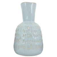Light blue ceramic vase with textured pattern, elegant home décor accent piece