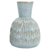Light blue ceramic vase with textured ribbed design, perfect for modern home décor and floral arrangements.