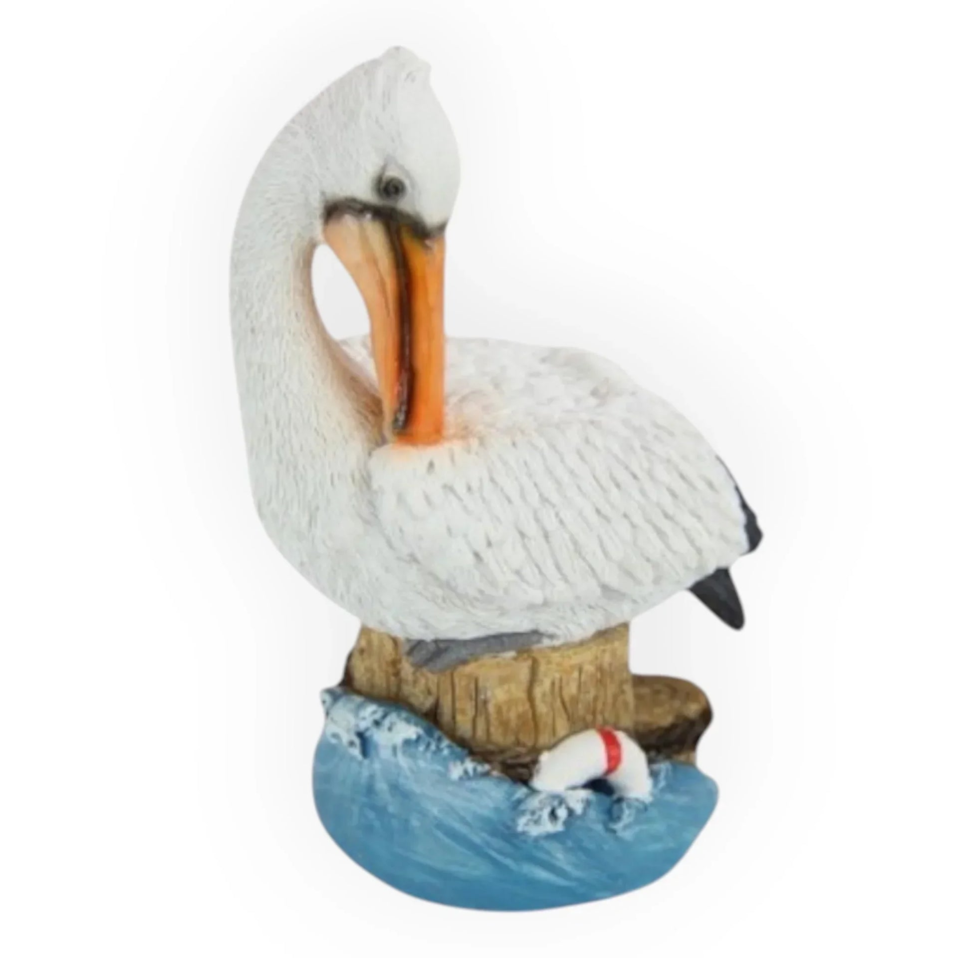 White pelican figurine perched on wooden post with blue waves, nautical home décor accent piece