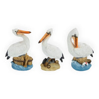 Set of three pelican figurines with nautical bases, coastal home décor accents