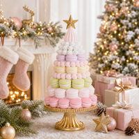 Holly & Ivy pastel macaron patisserie tree on a gold stand in a festive holiday setting