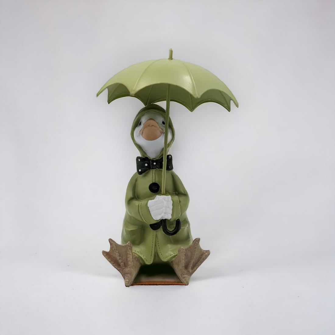Rainy Duck Sitting with Umbrella