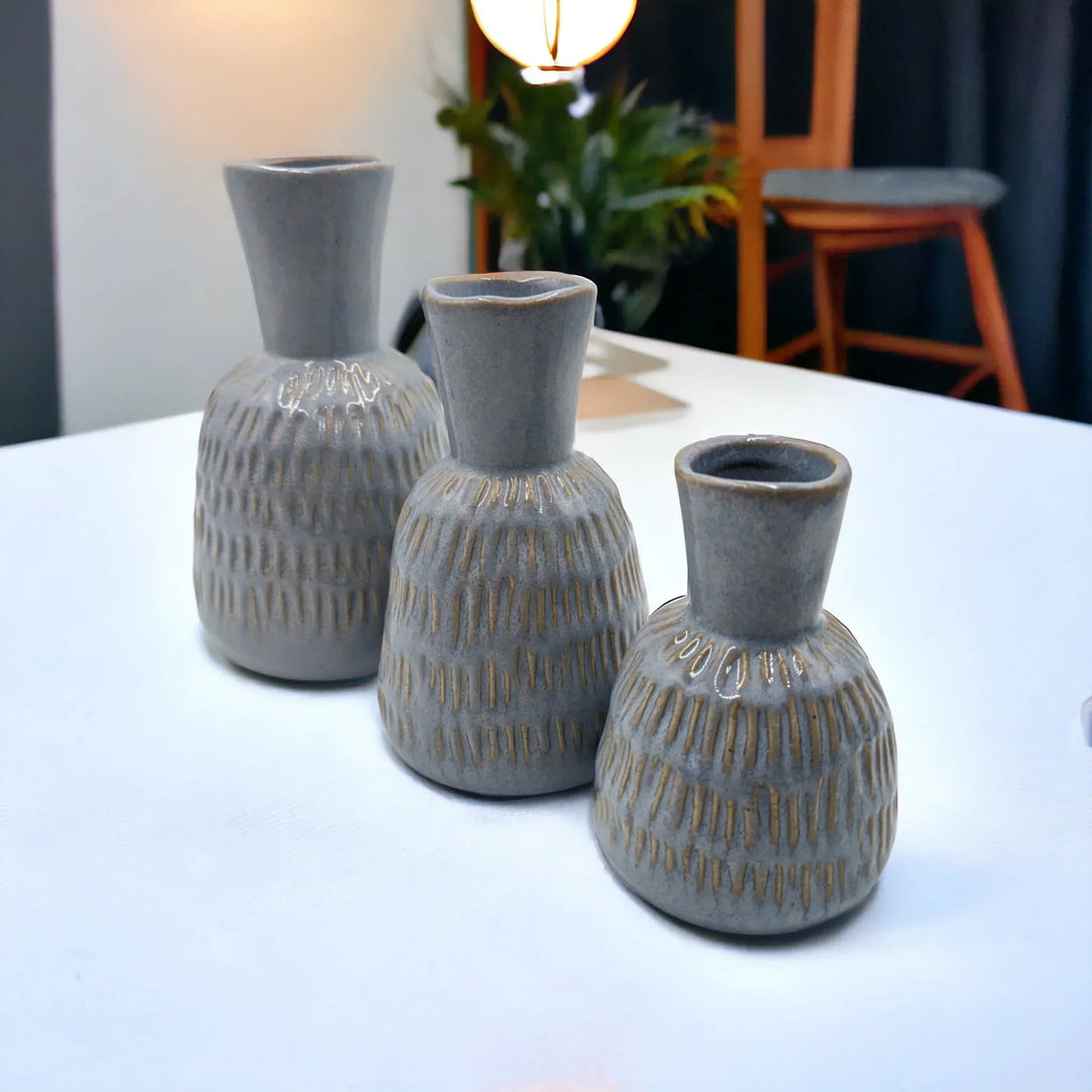 Set of three grey textured ceramic vases with gold accents, modern home décor for living room or dining table