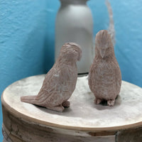 Handcrafted ceramic bird figurines, rustic home décor accents on wooden stand, vintage-inspired design