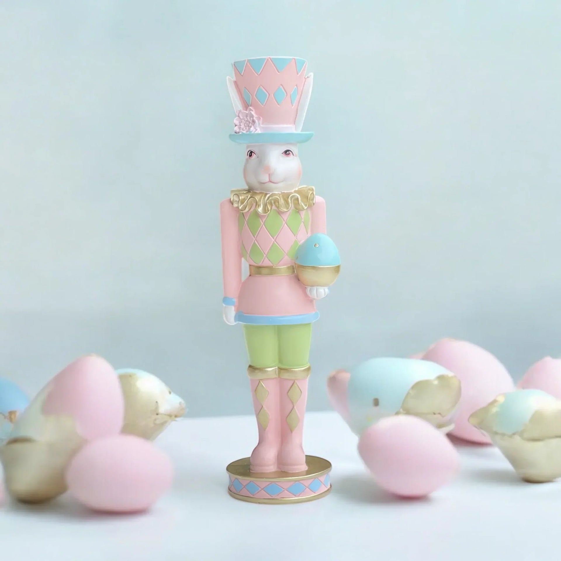 Pastel Easter bunny nutcracker figurine with egg, home décor accent for spring holidays