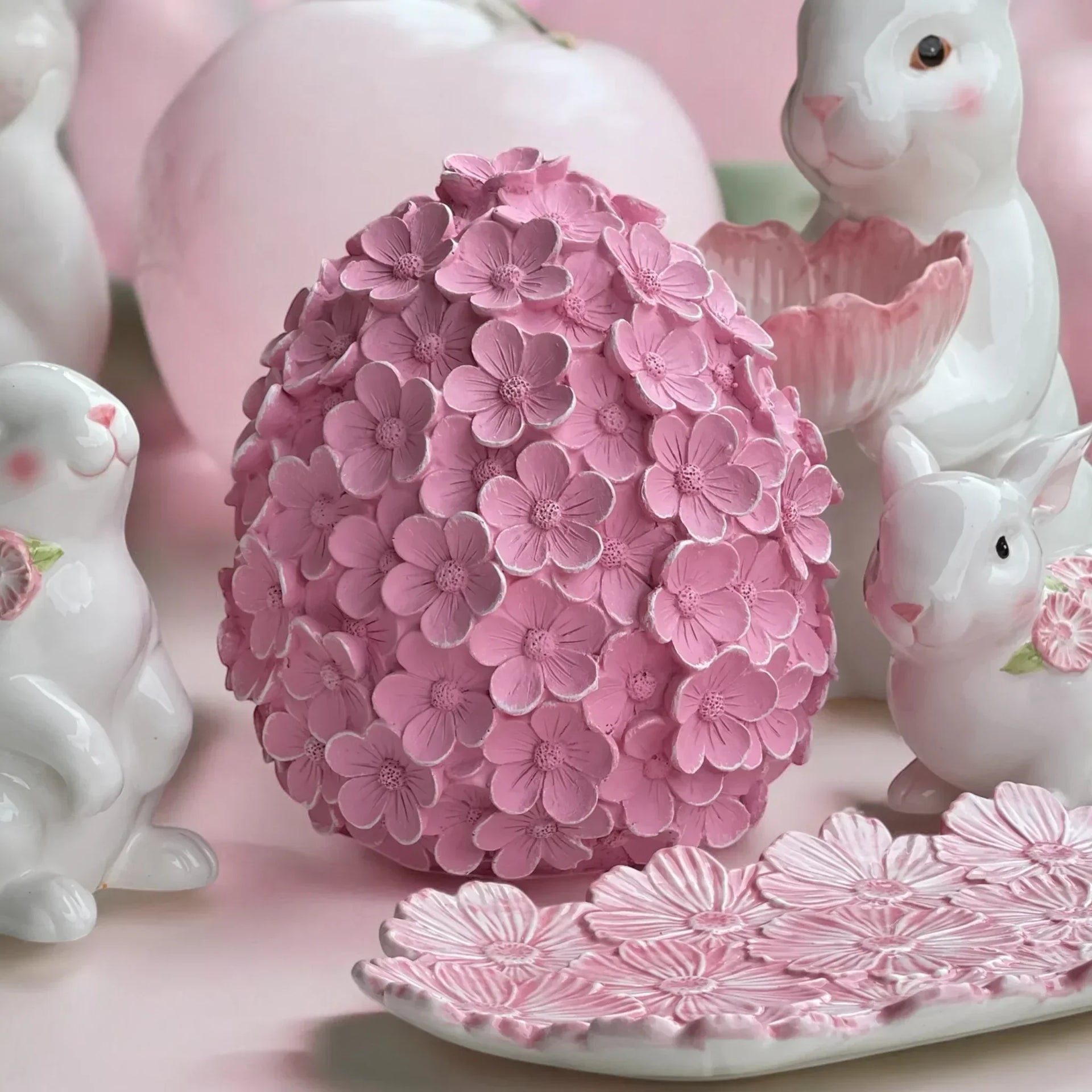 Pink floral egg decor with ceramic bunnies, perfect for spring home styling and Easter displays