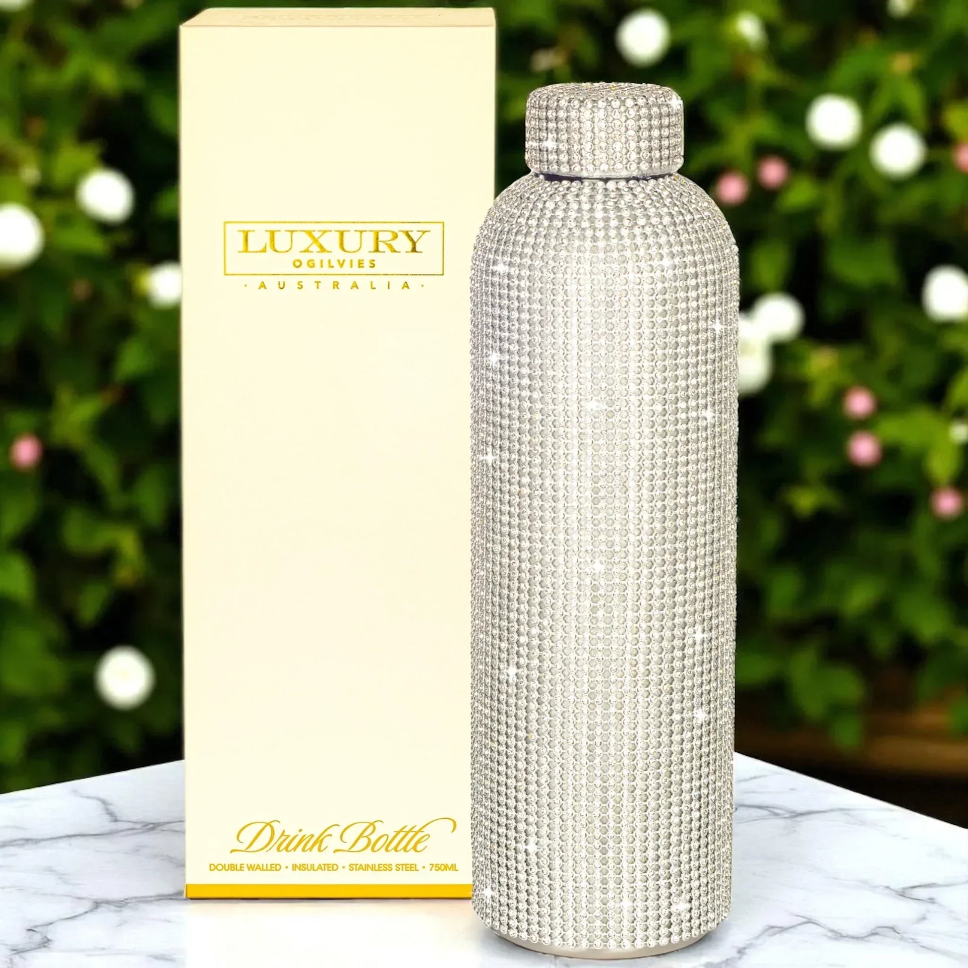 Luxury crystal-embellished stainless steel drink bottle with gift box, perfect for elegant home décor or gifting.