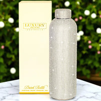 Luxury crystal-embellished stainless steel drink bottle with gift box, perfect for elegant home décor or gifting.