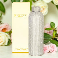 Luxury crystal-encrusted stainless steel drink bottle with floral backdrop, 750ml capacity