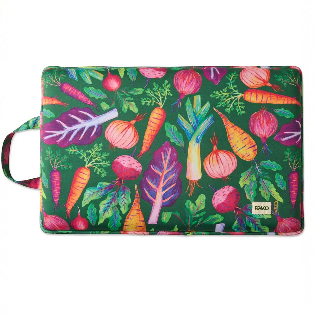 Colorful vegetable print cushion with carrots, onions, beets on green background, home decor accent