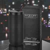 Black insulated travel mug with lid, stainless steel, 350ml, next to luxury packaging on marble surface