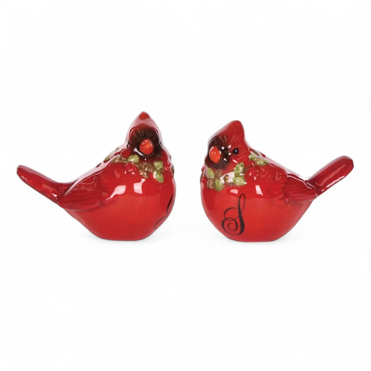 Red cardinal bird figurines with holly, festive home décor accents
