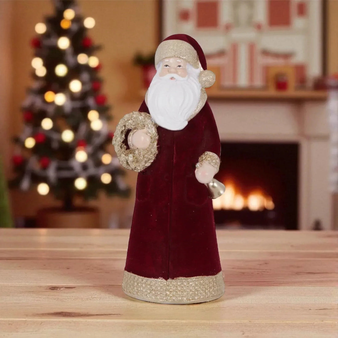 Velvet Santa Claus figurine with gold trim, holding wreath and bell, festive holiday decor for home