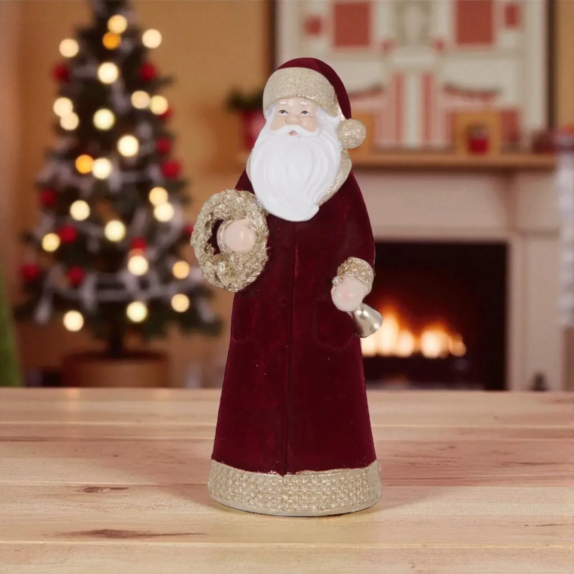 Velvet Santa Claus figurine with gold trim, holding wreath and bell, festive holiday decor for home