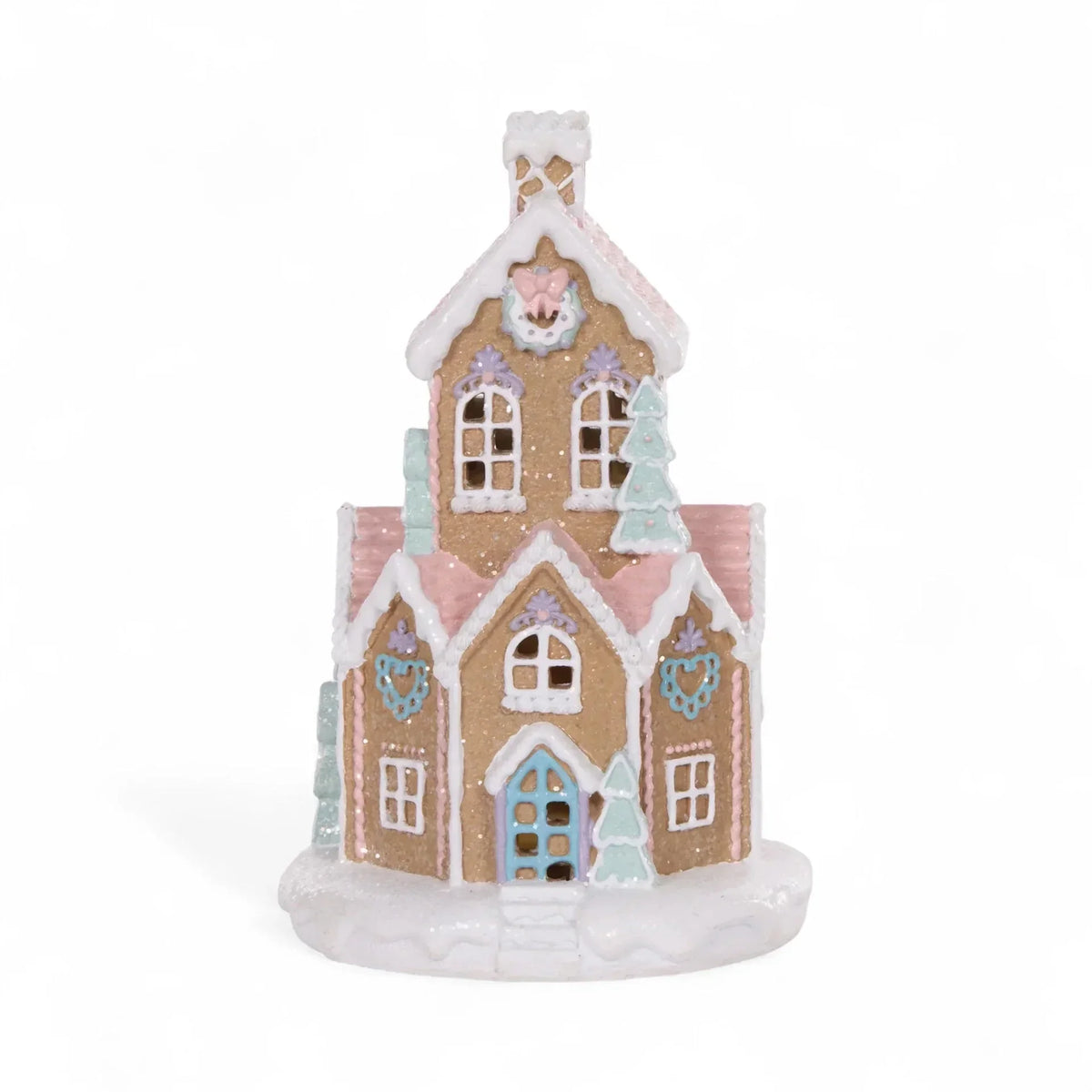 Pastel gingerbread house decoration with glitter, heart details, and snowy roof for festive home décor