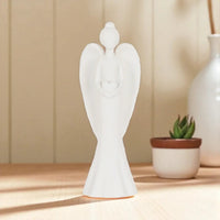 White ceramic angel figurine with heart, home décor accent piece