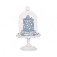 Elegant blue cake under glass dome on white pedestal, vintage home decor accent piece