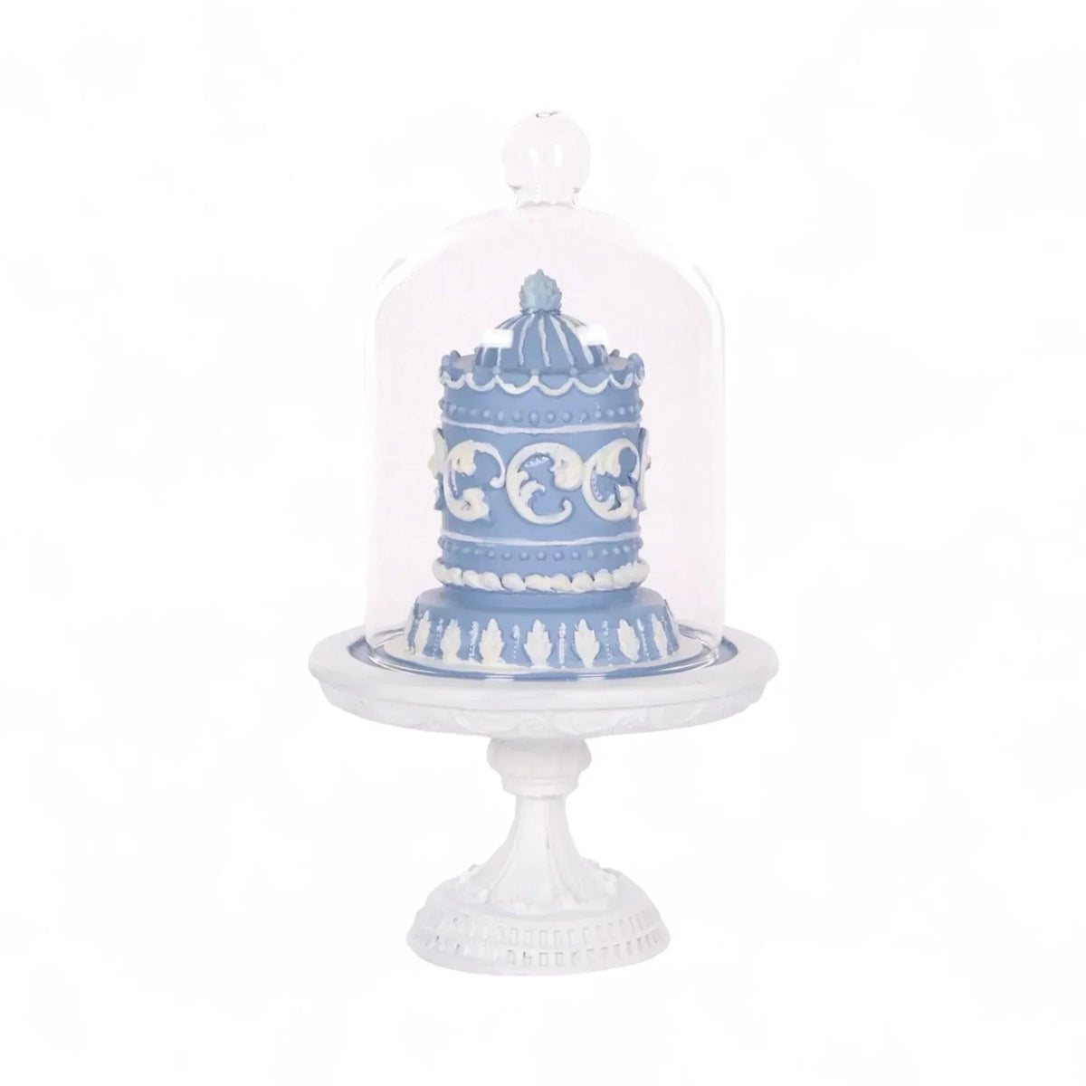 Blue and white decorative cake under glass dome on ornate pedestal, elegant home décor accent piece