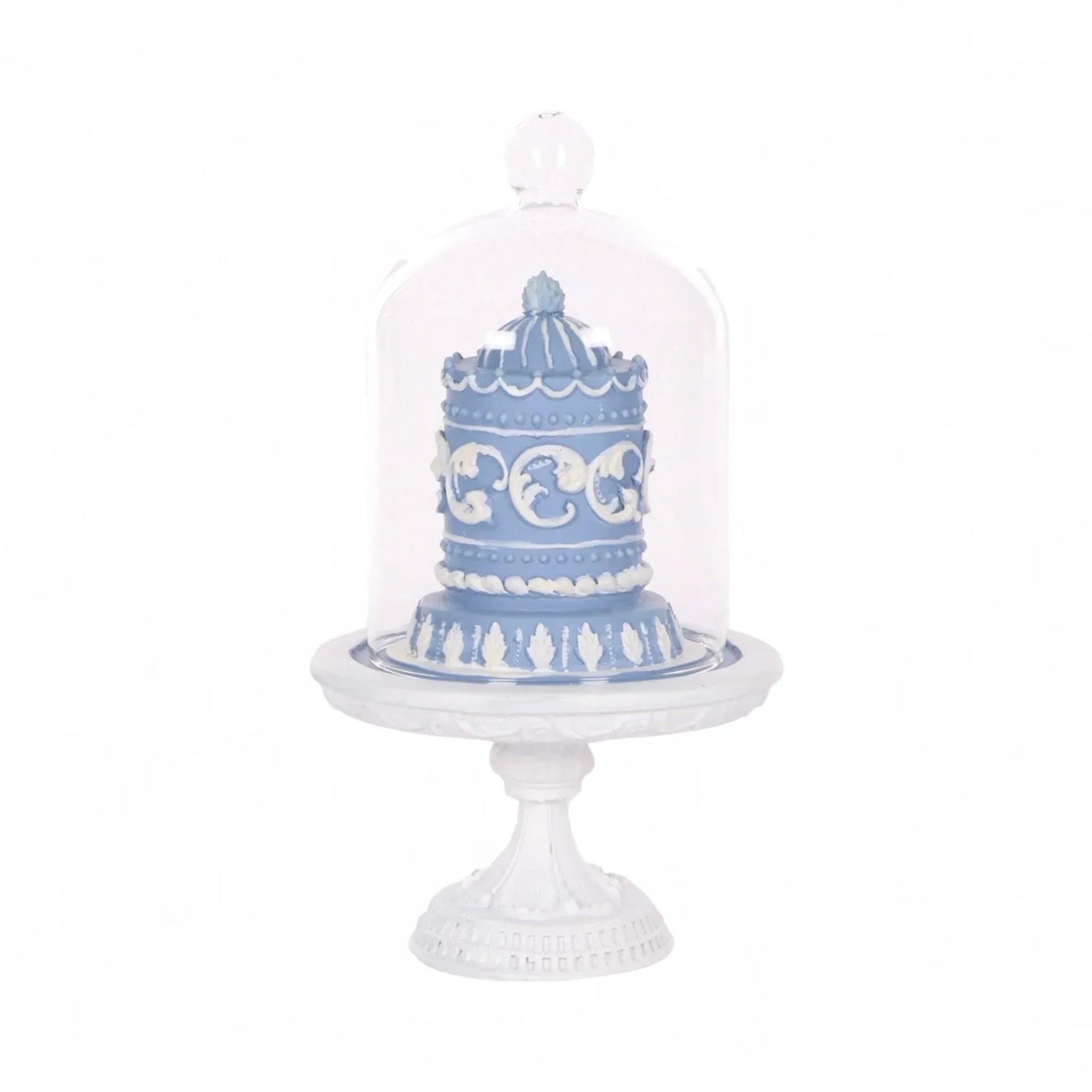 Blue and white decorative cake under glass dome on ornate pedestal, elegant home décor accent piece