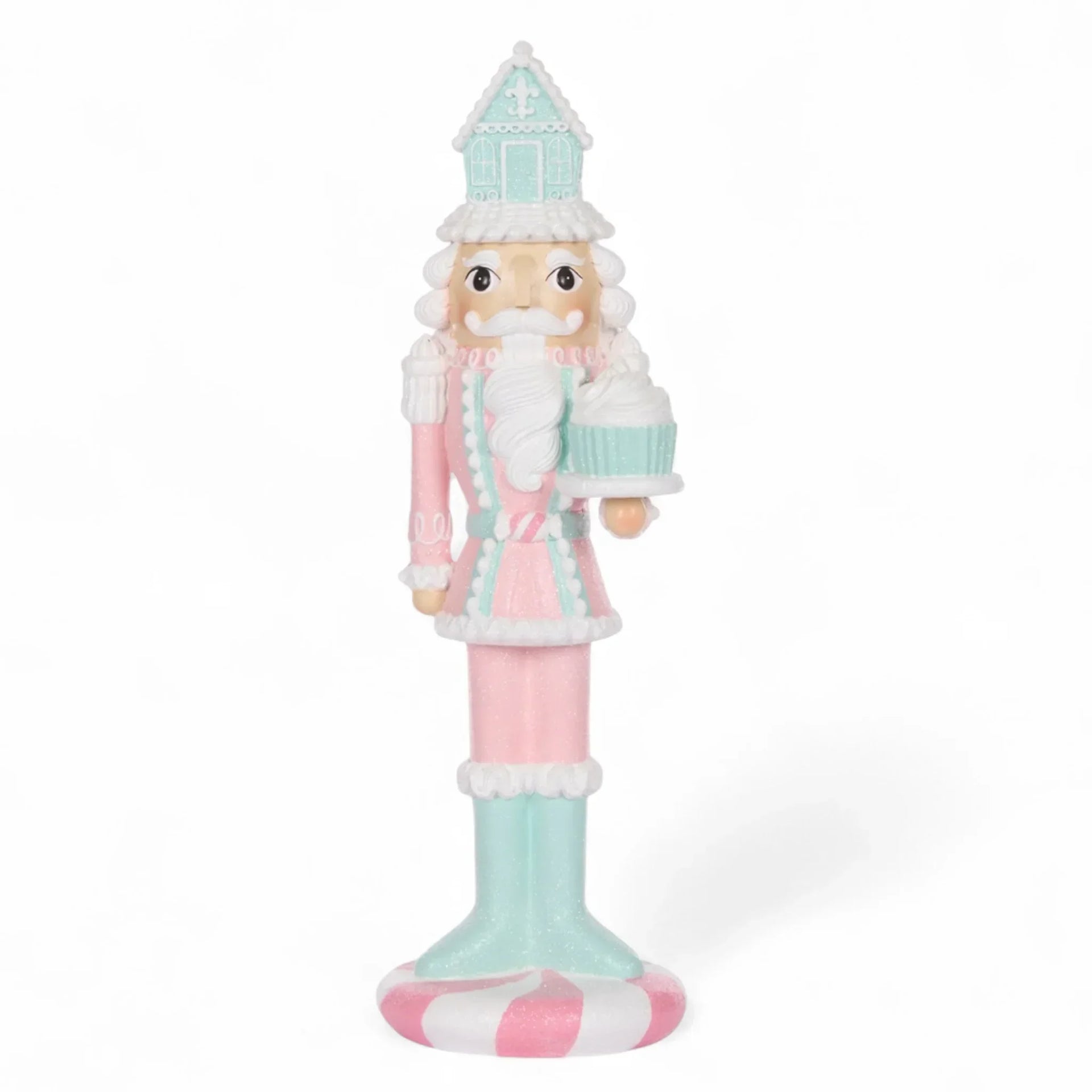 Pastel pink and mint nutcracker figurine holding cupcake, festive holiday decor for home