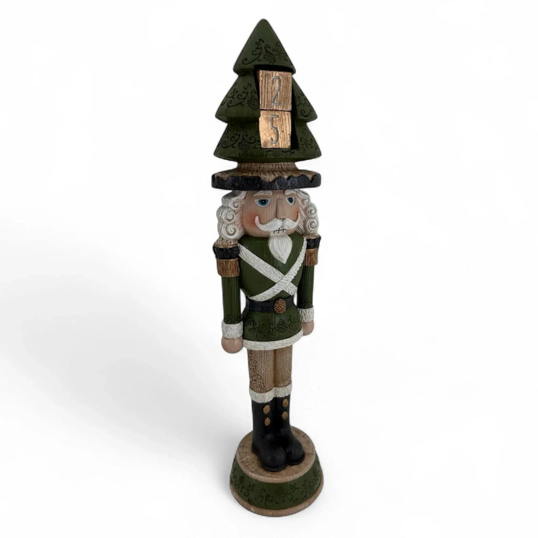 Green nutcracker figurine with Christmas tree hat and wooden '25' blocks, festive holiday decor