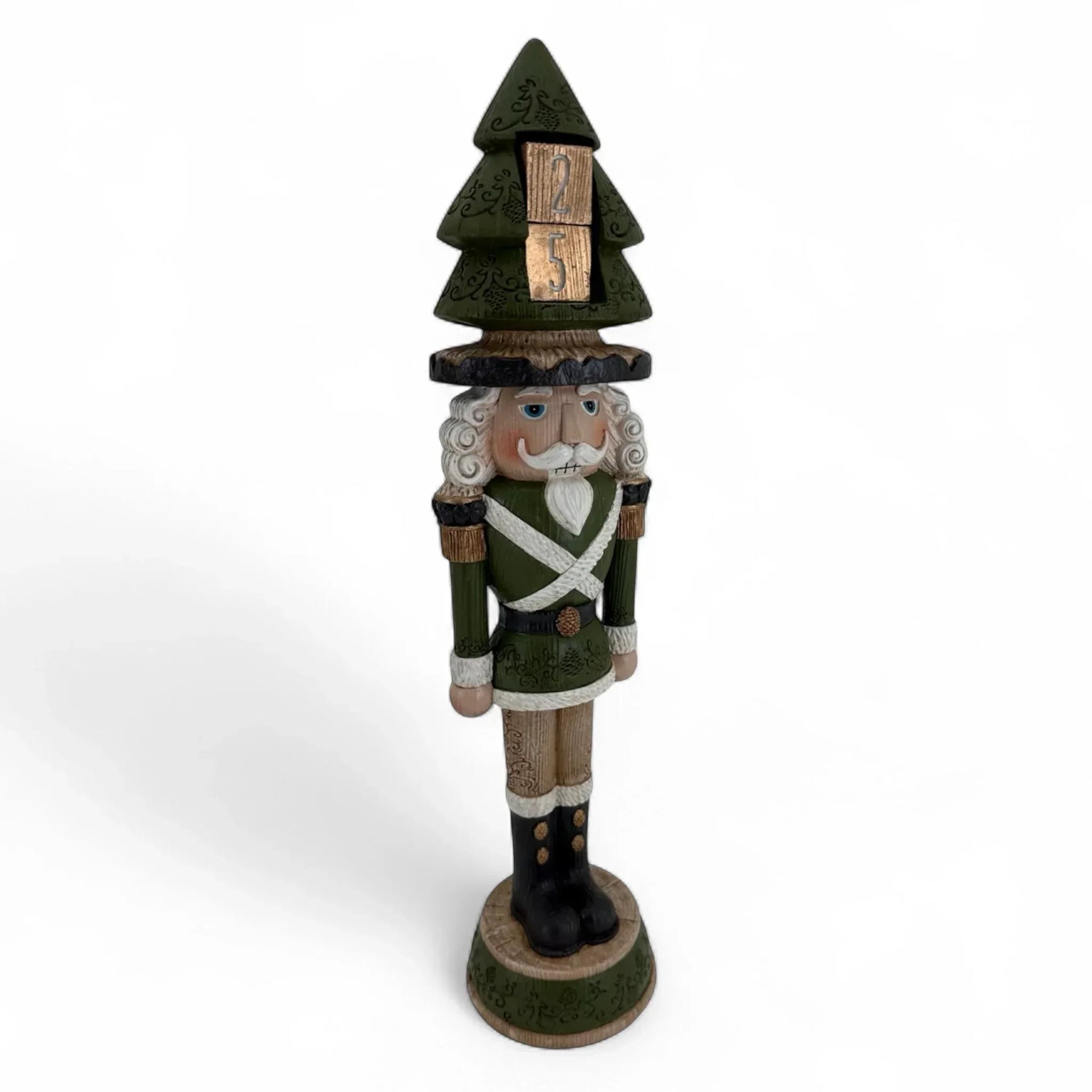 Green nutcracker figurine with Christmas tree hat and wooden '25' blocks, festive holiday decor